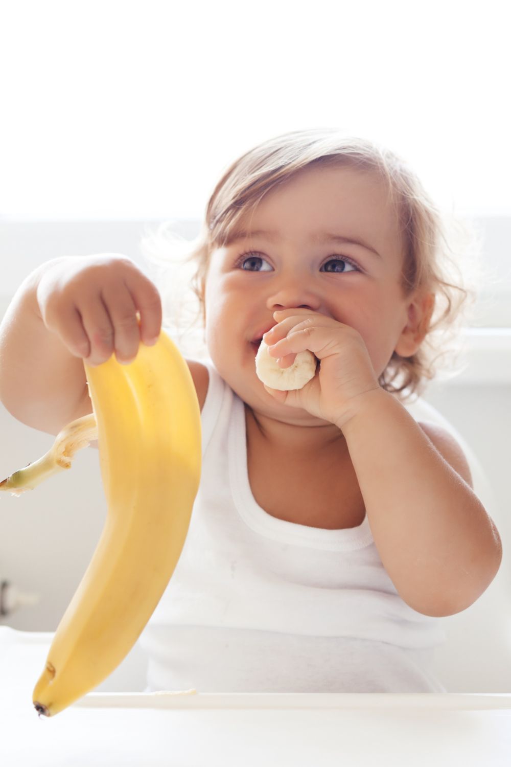 Toddler eating fresh fruits