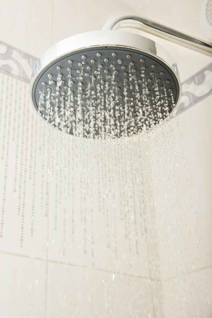 shower head with drops and streams of water