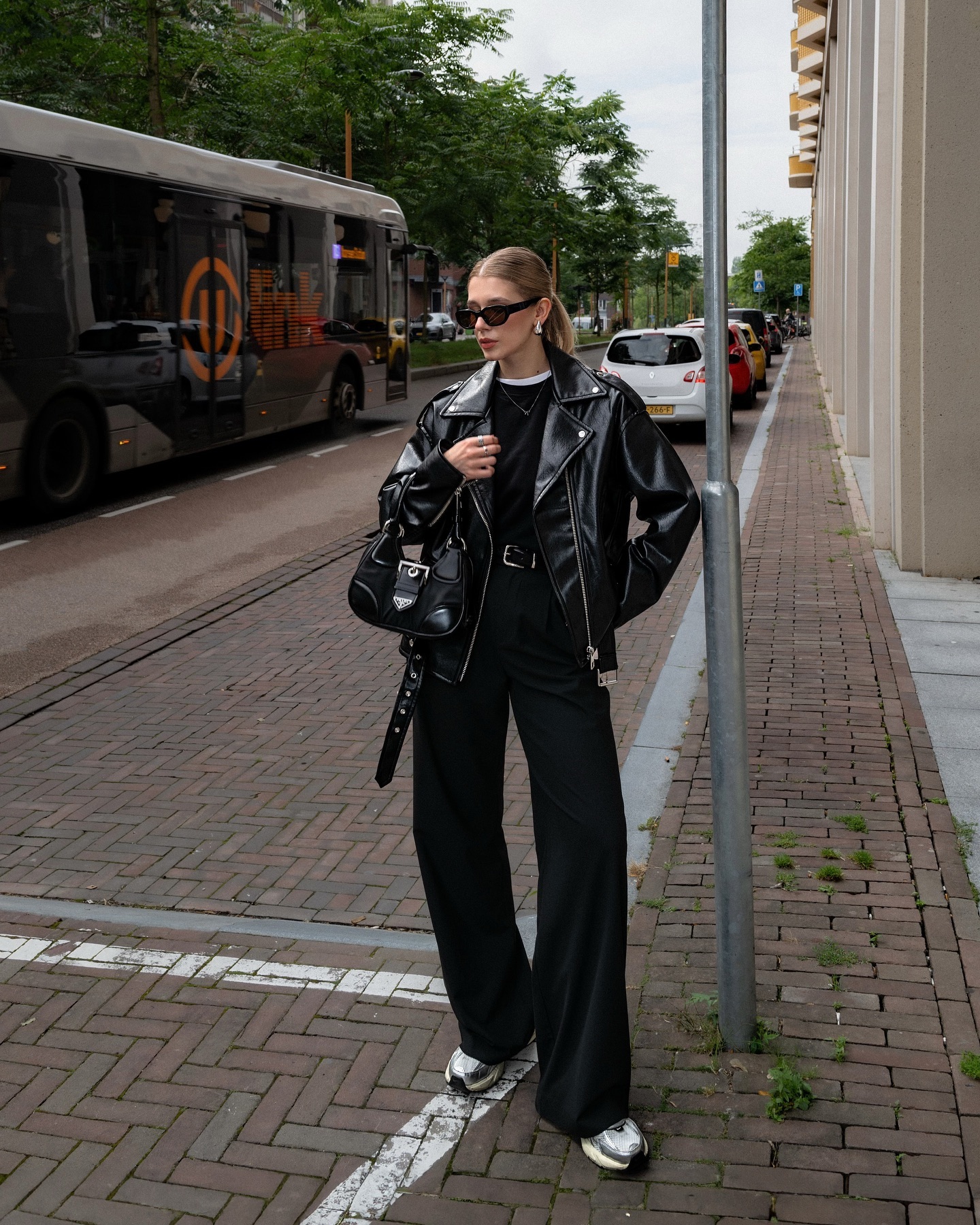 Fitted black jeans with a leather biker jacket