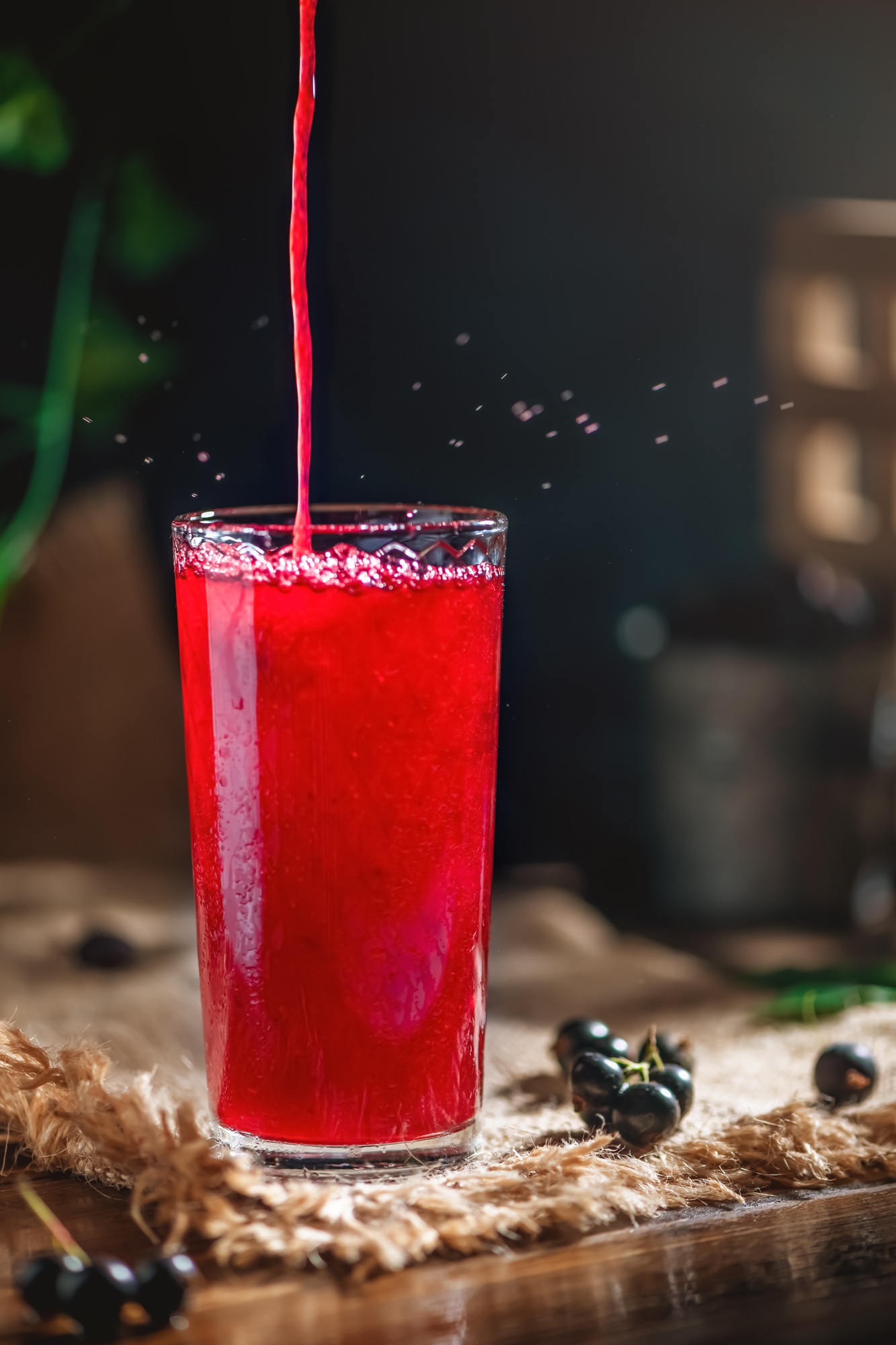 fruit juice of berries in a glass transparent glass