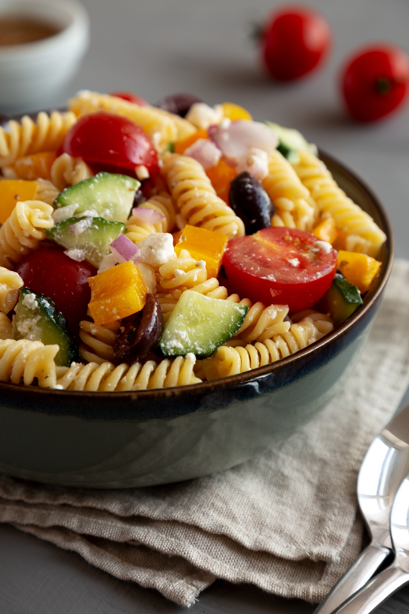 Homemade Organic Greek Pasta Salad in a Bowl, side view. Close-up.