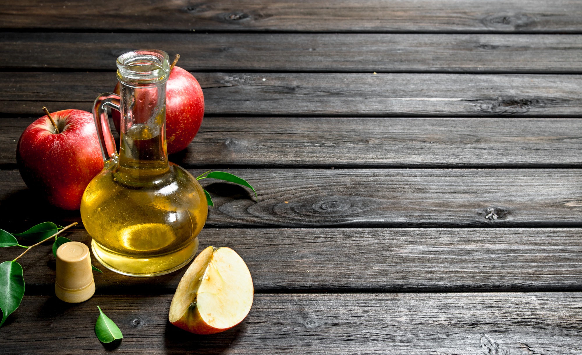 Apple cider vinegar with fresh apples.