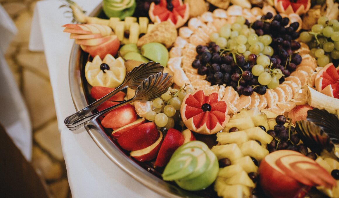 Closeup of beautifully decorated fruits on a large tray, fruit party tray