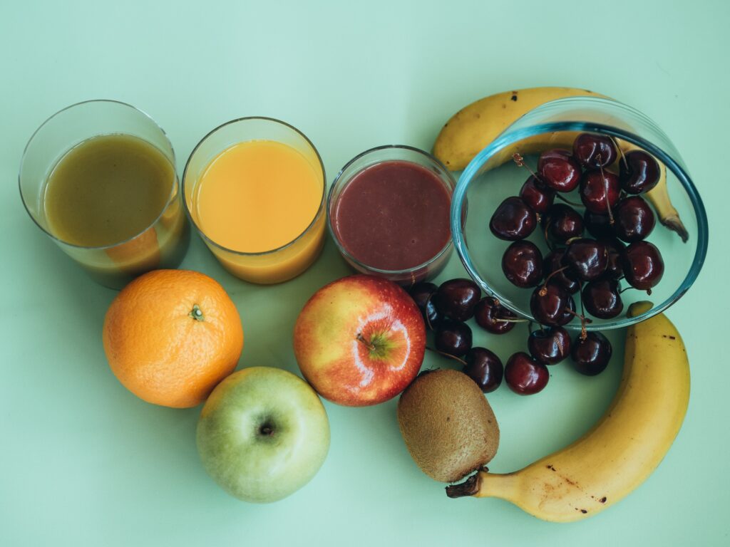 photography of different ingredients to make a healthy meal. Vegetable and fruit juices.