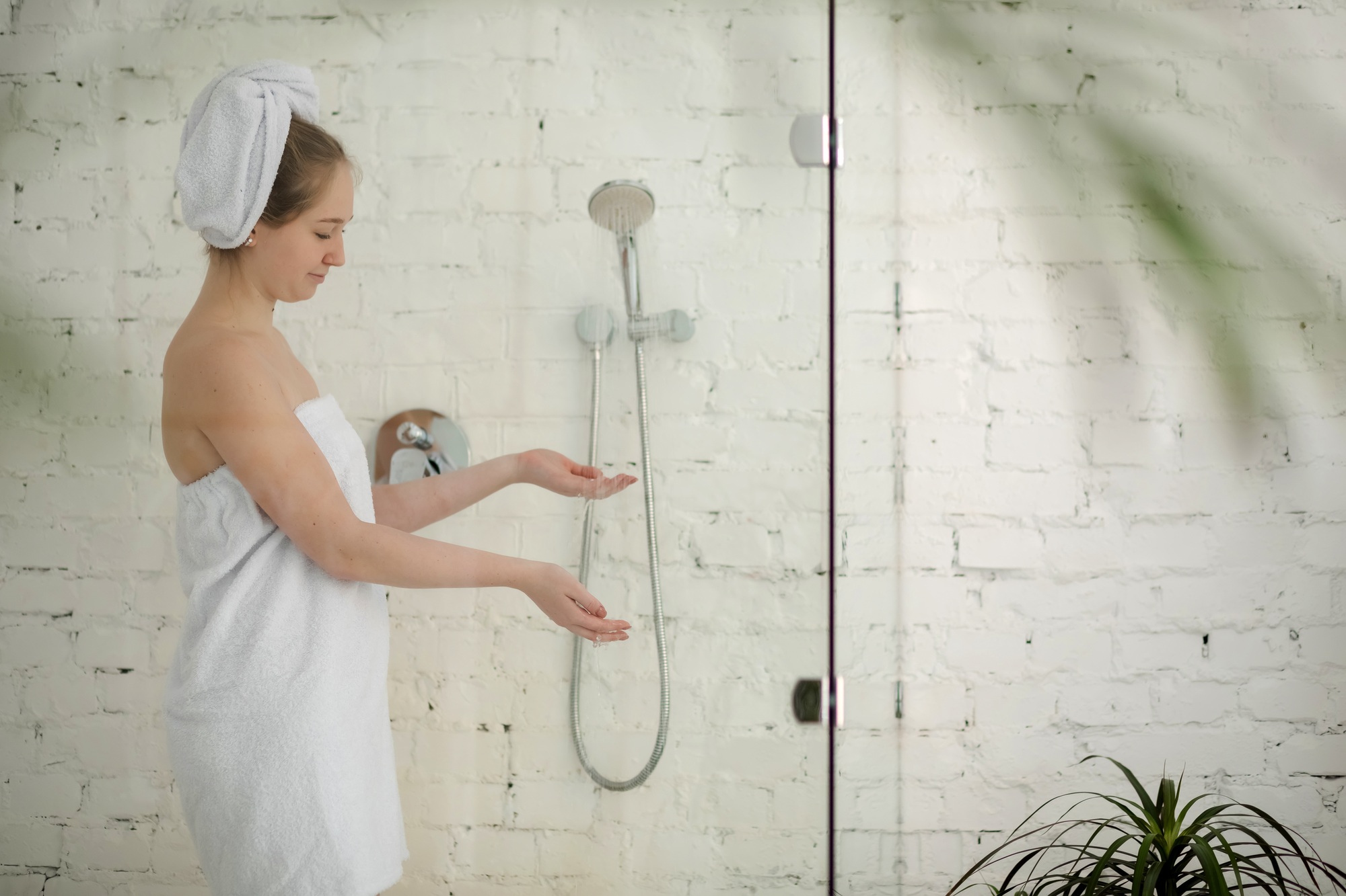 Young woman taking a shower
